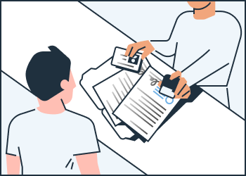 a person getting documents reviewed by a notary